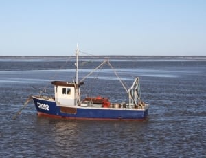 landscape photography of fishing boat thumbnail