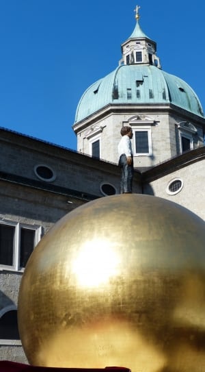 brass ball with human statue landmark thumbnail