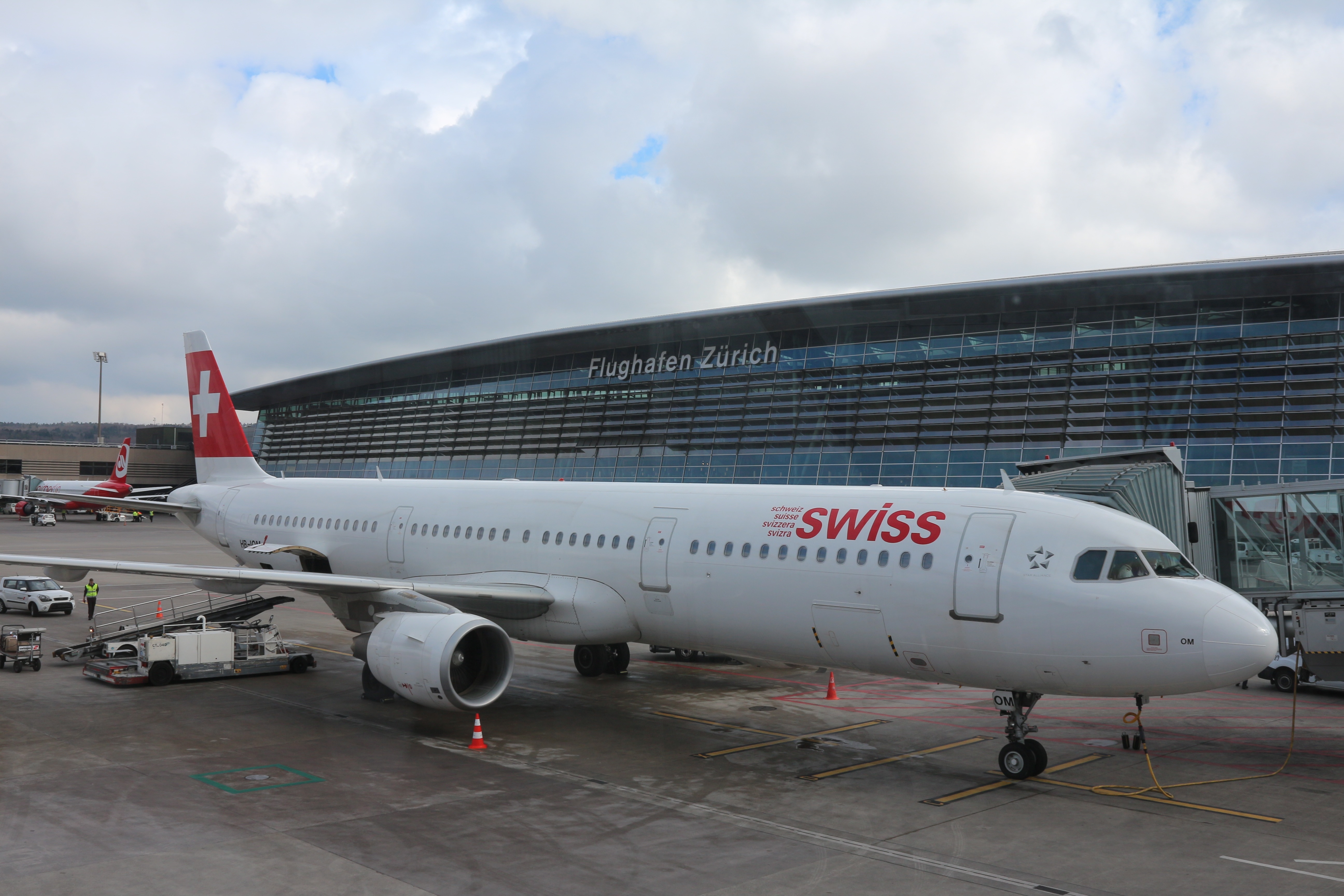 white and red swiss airplane