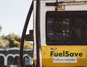 white and yellow shell fuelsave gas pump at daytime thumbnail