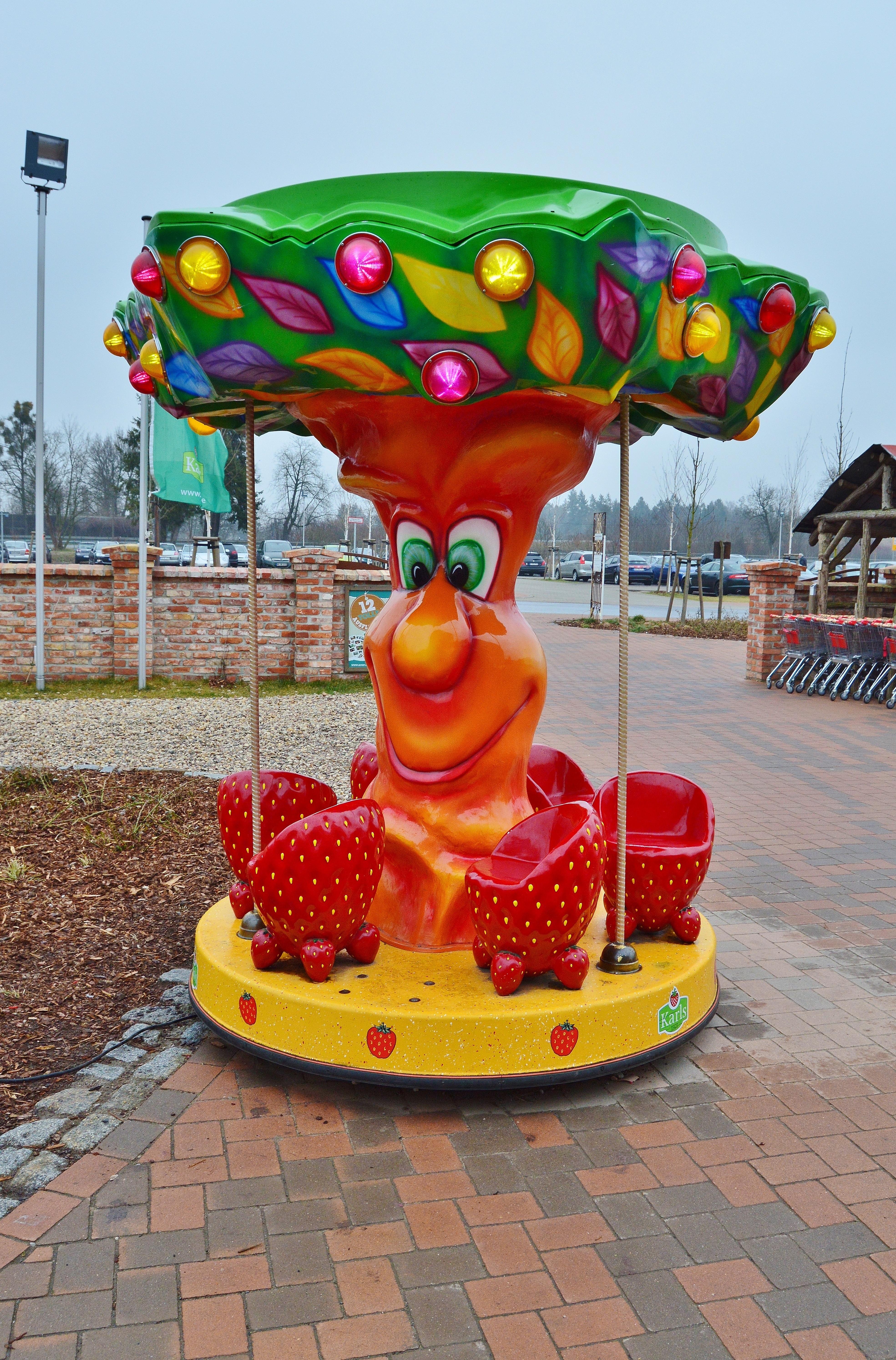 orange green and yellow tree and strawberry carousel