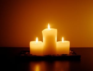 3 pillar lighted candles thumbnail