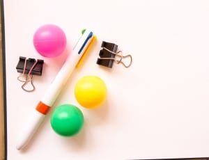 multi-colored pen and 3 plastic balls thumbnail
