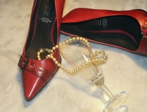 women's red pointed toe pumps with pearl necklace and champagne glass thumbnail