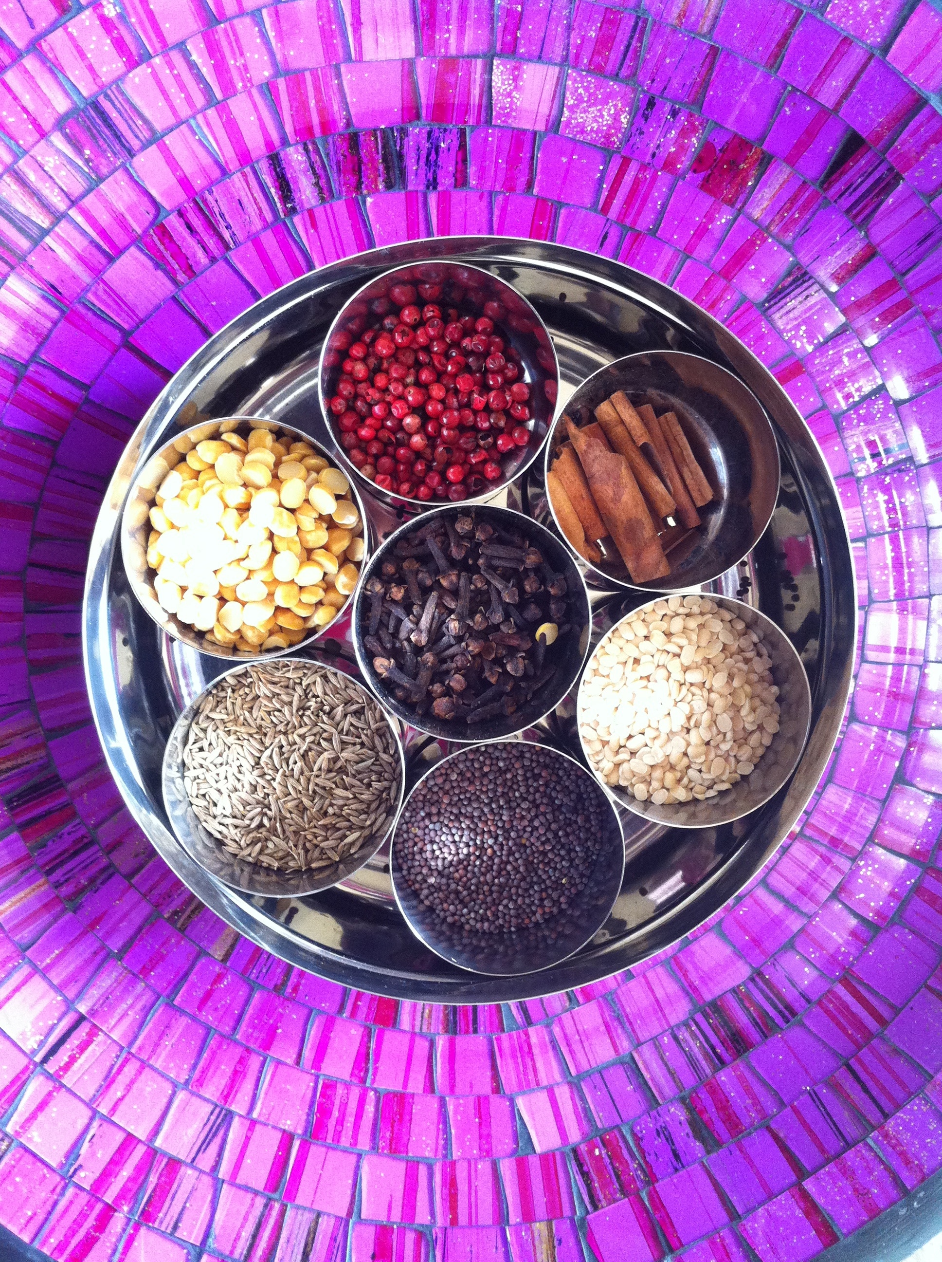 varieties of spices on gray round container