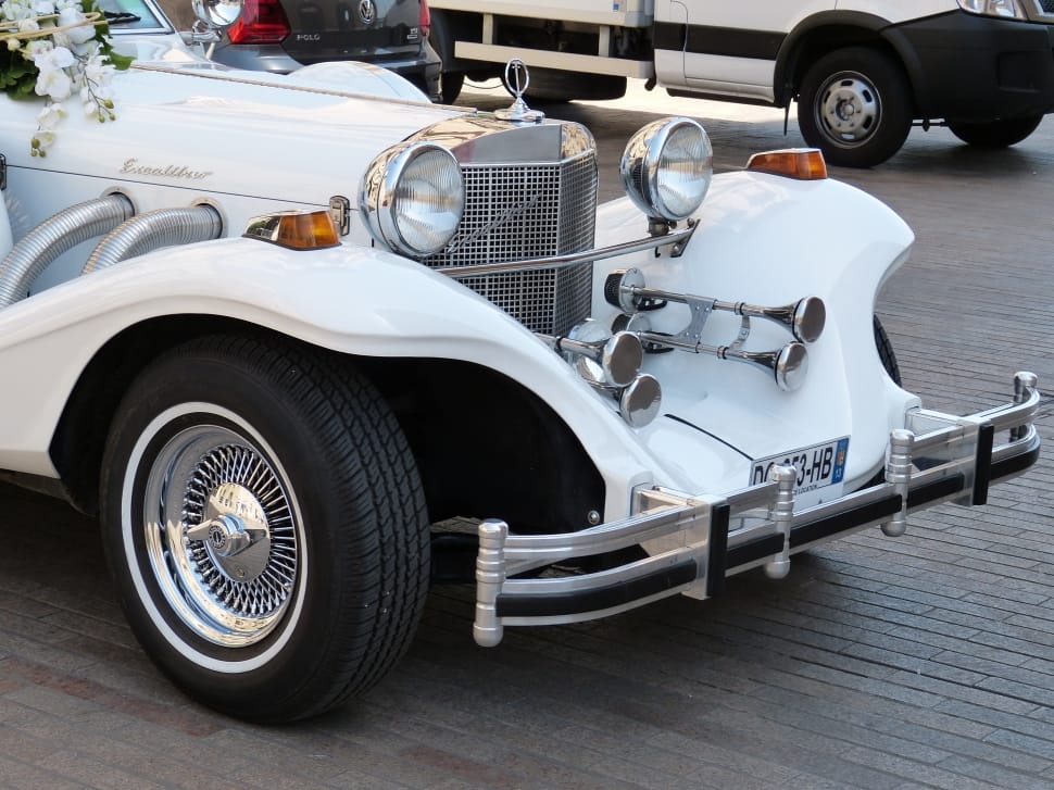 white vintage luxury roadster preview