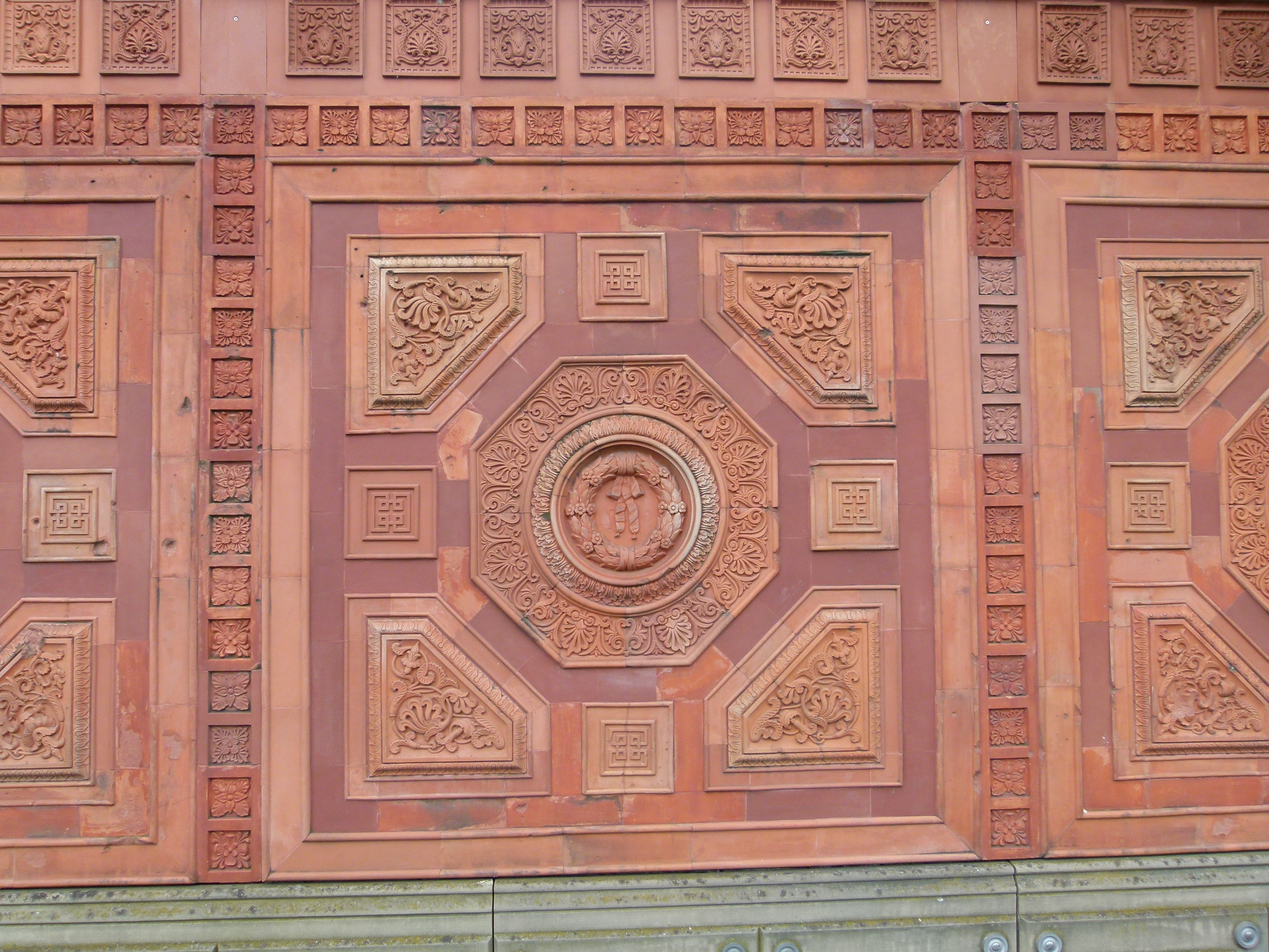 brown and purple wall carving