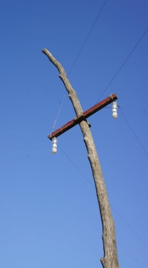 brown wooden power line post thumbnail