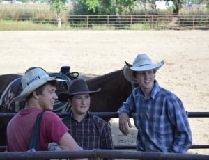 men's three white and brown cowboy hats; plaid long sleeve shirts; red crew neck t shirt thumbnail