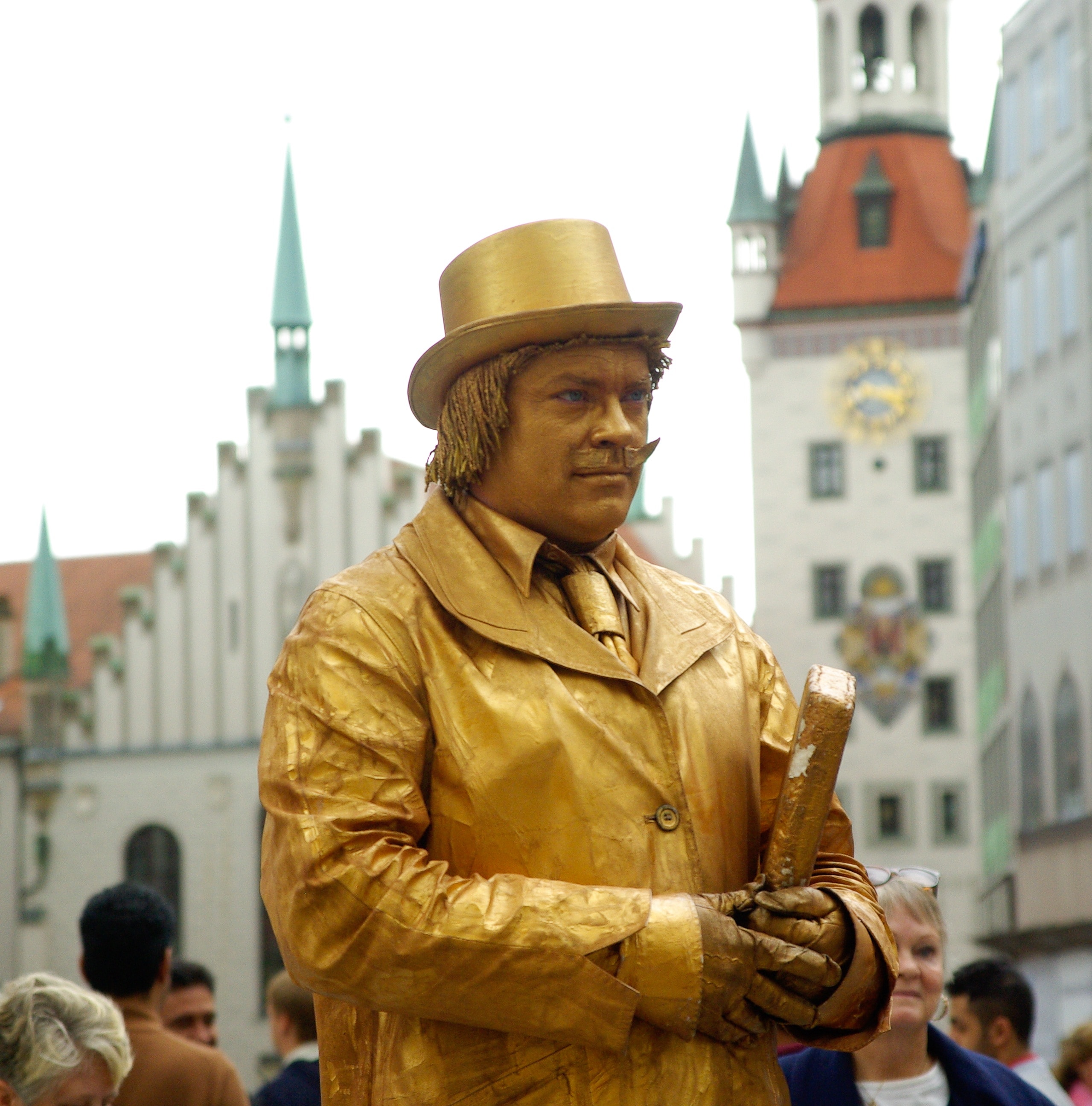 man wearing gold coat