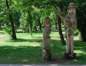 two man and woman wooden carving statue thumbnail