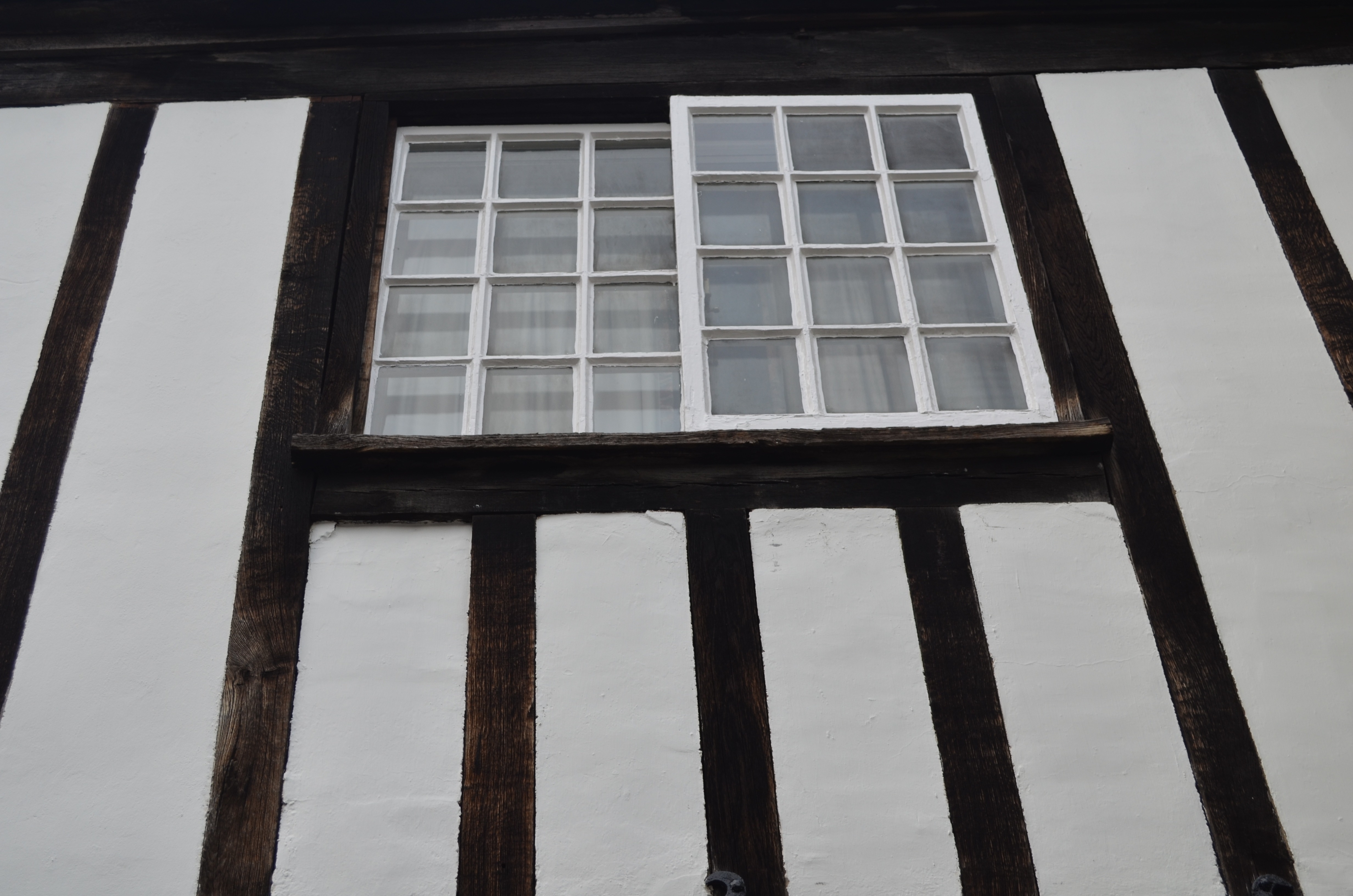 white metal frame glass window