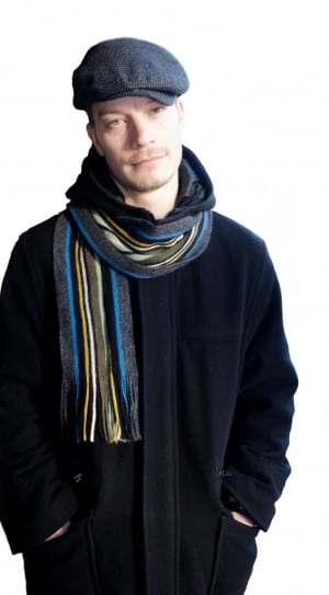 men;s black top coat; blue-gray-yellow knit scarf outfit thumbnail