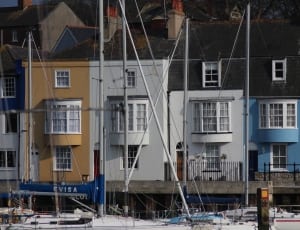 sailboats above houses during daytime thumbnail