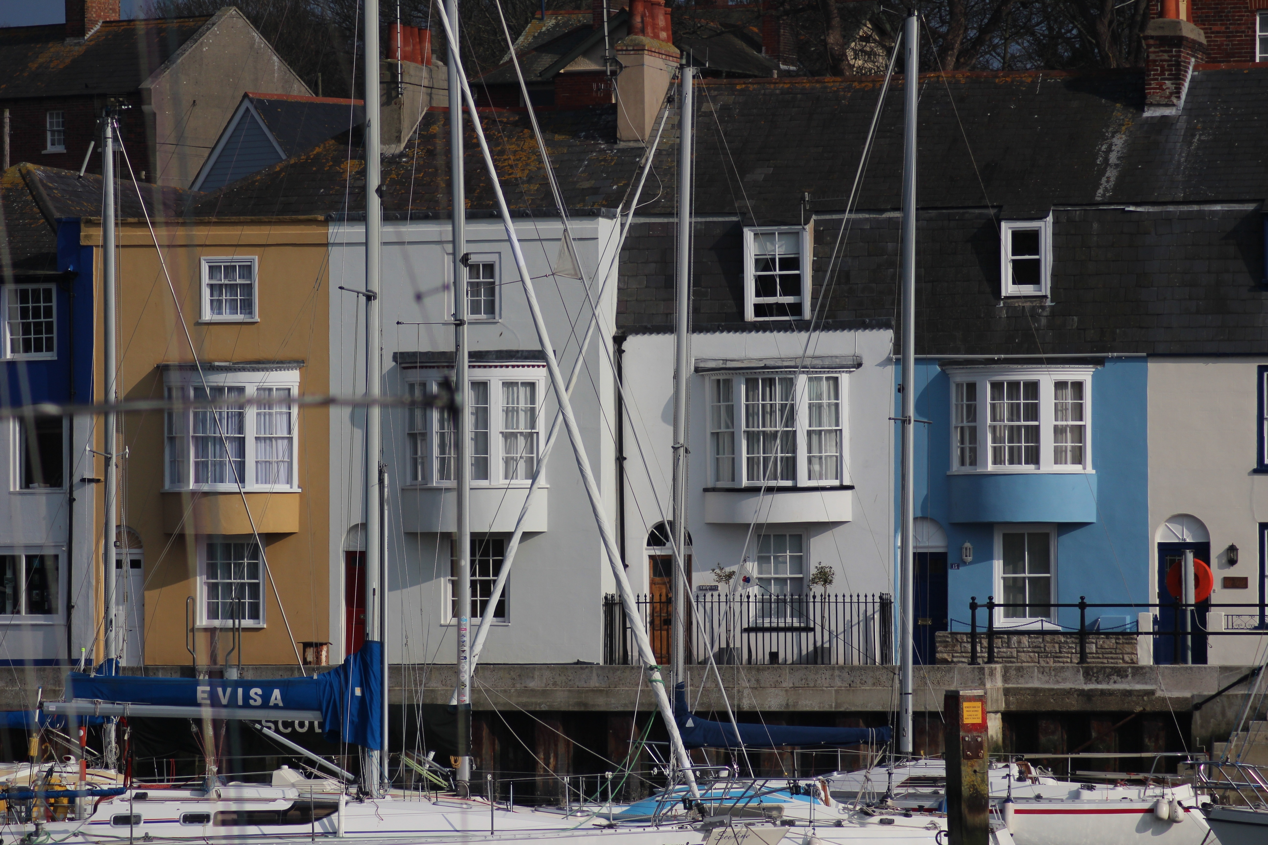 sailboats above houses during daytime
