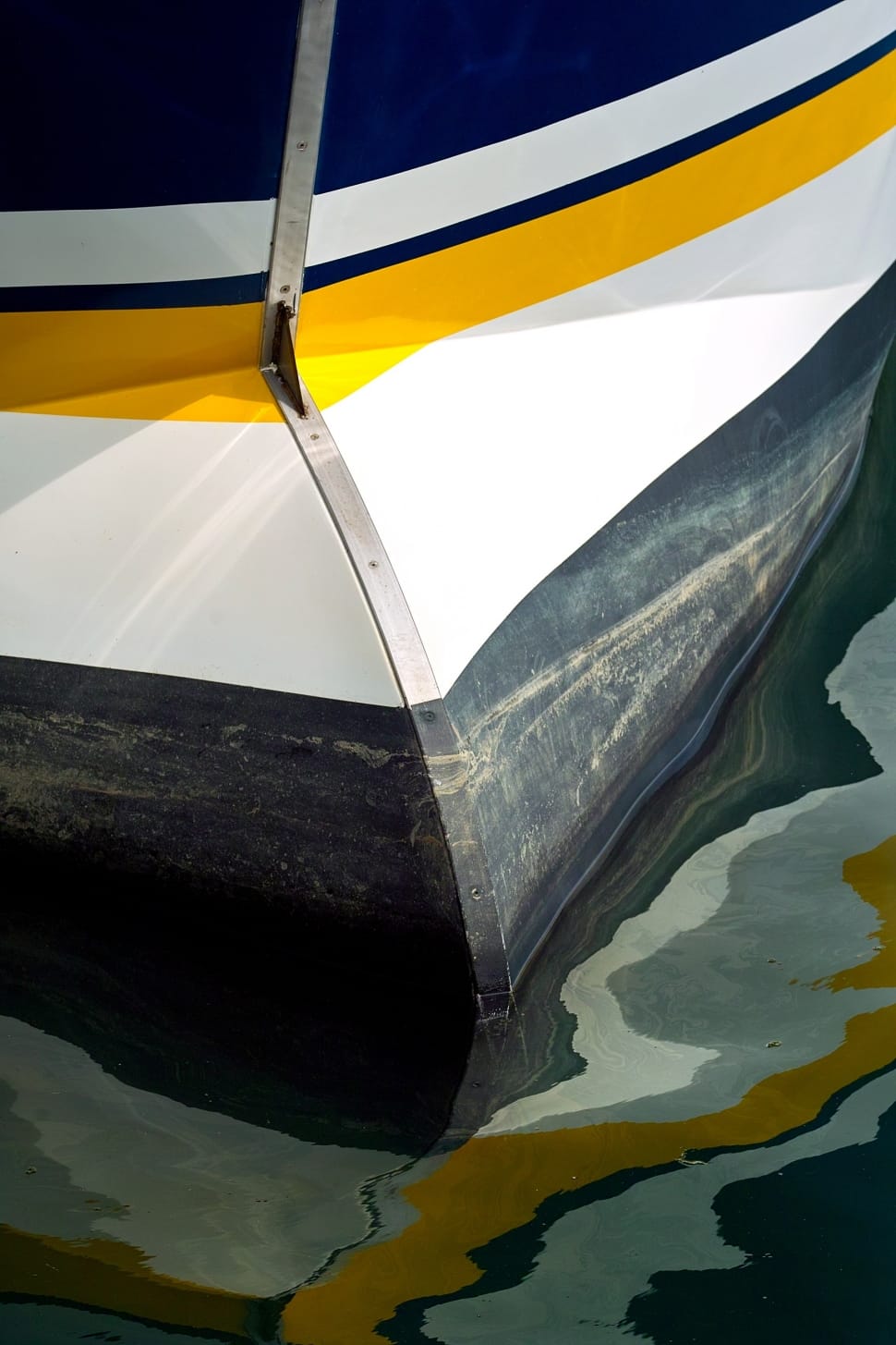 yellow white and blue boat preview