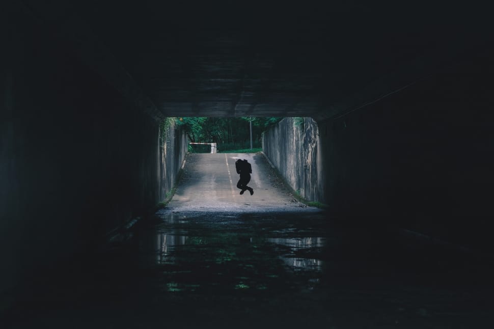 silhouette of person jumping in tunnel preview