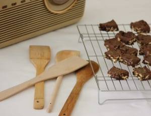 wooden spatulas near cookies on grill thumbnail