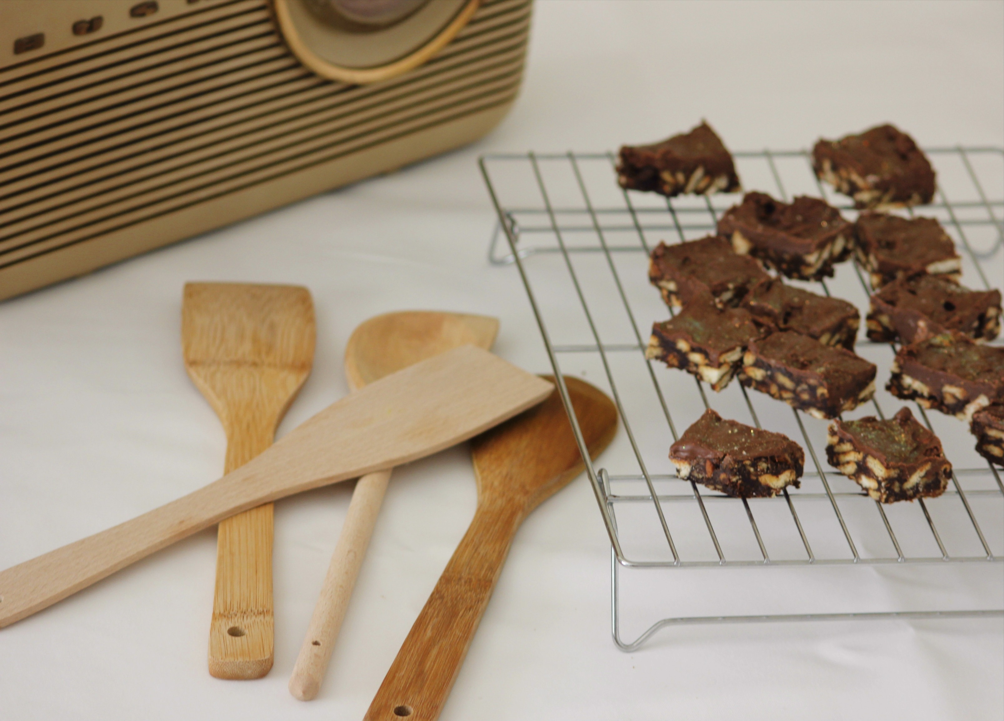 wooden spatulas near cookies on grill