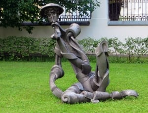 man wearing hat outdoor statue thumbnail