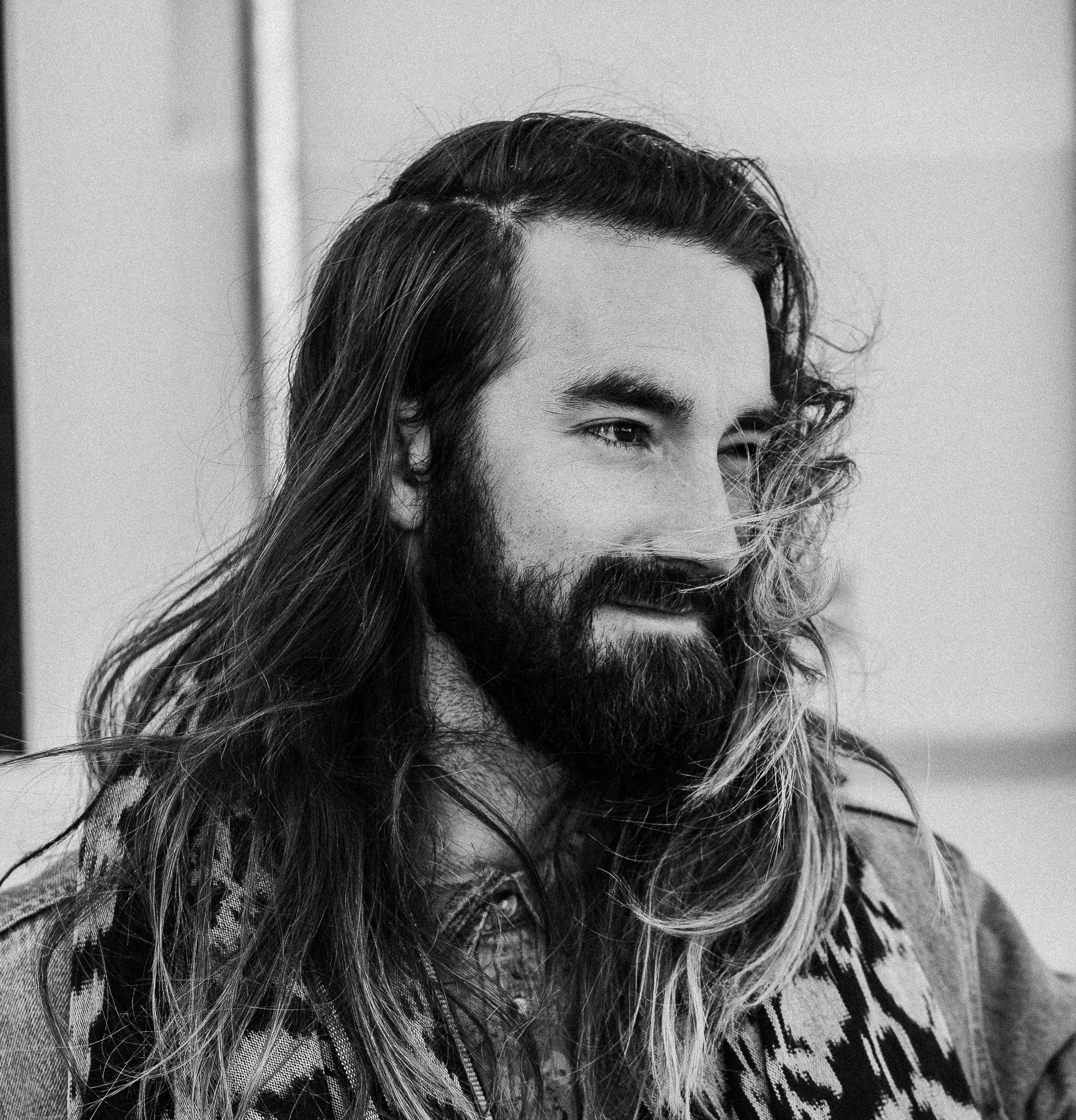 portrait photography of a long hair man