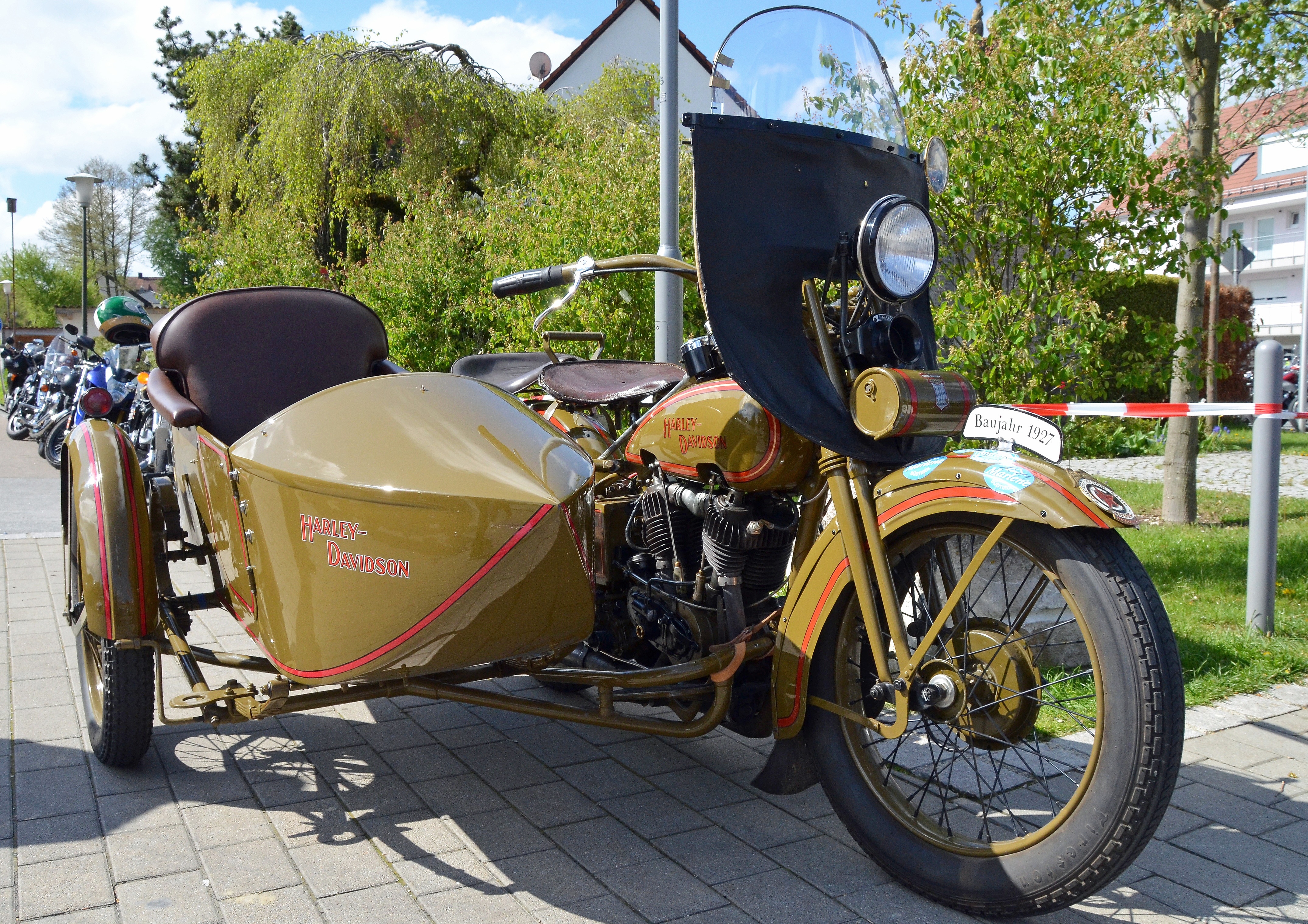 brown standard motorcycle with cab