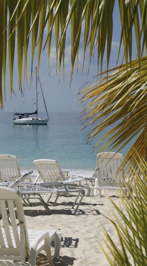 white wooden beach chairs and white boat thumbnail