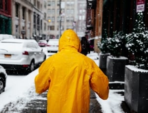 human wearing yellow rain coat thumbnail