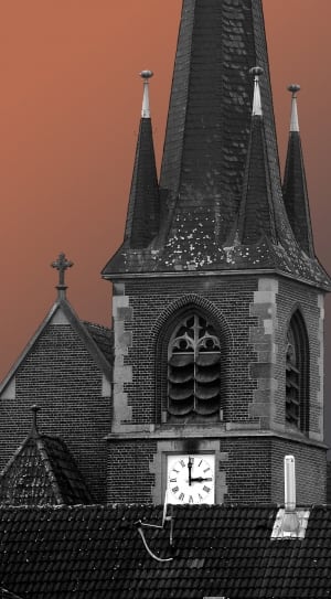 grey and black cathedral with analog clock thumbnail