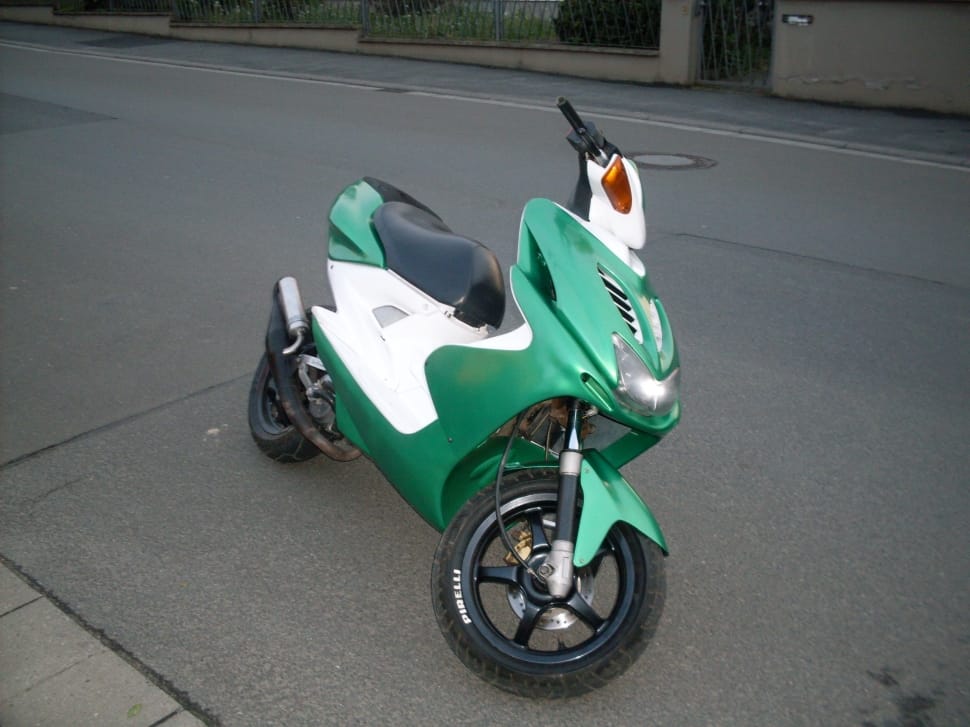 green and white motor scooter preview