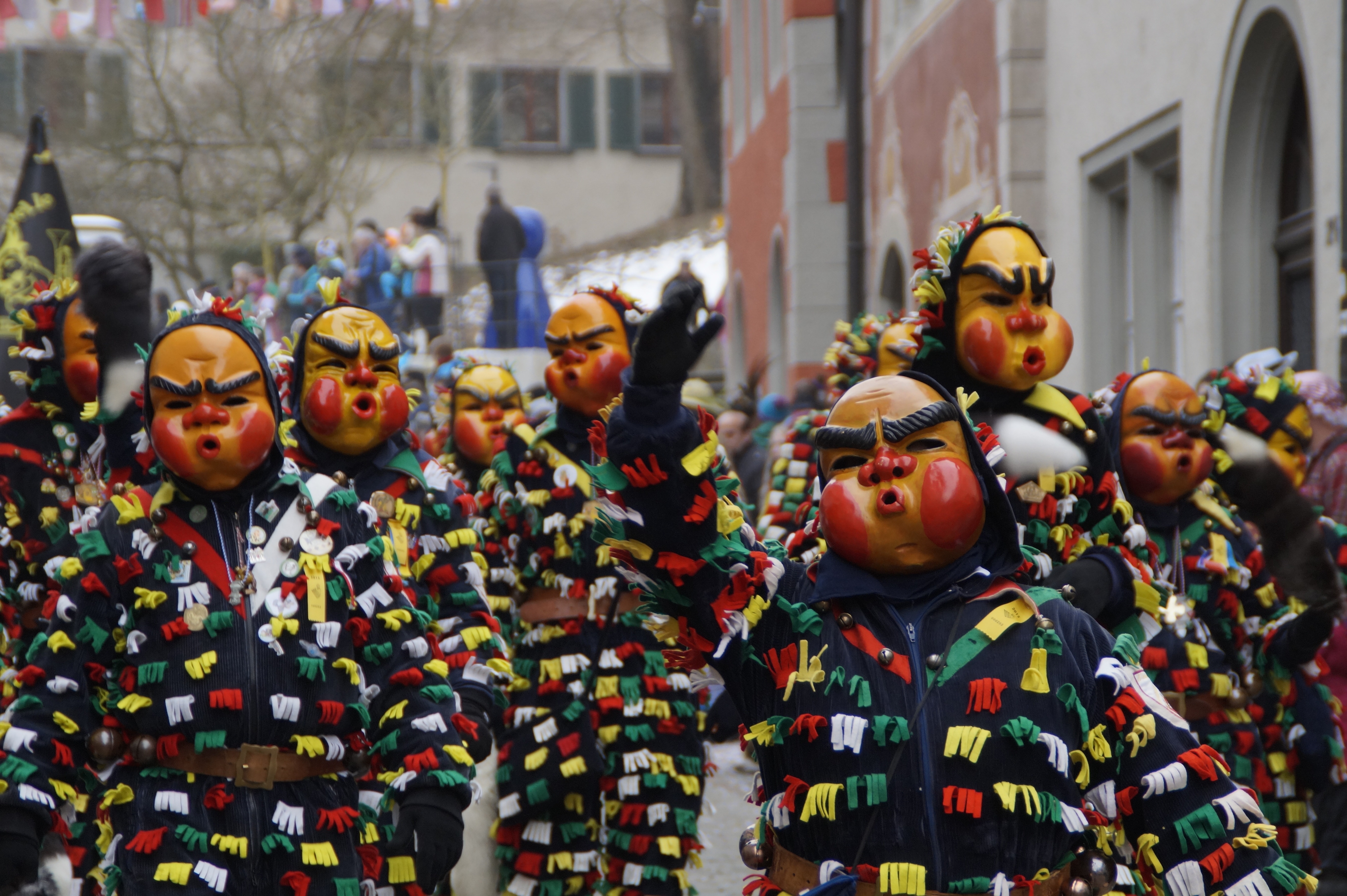 parade of people wearing mask
