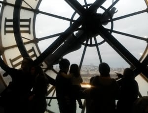 silhouette of people inside clock tower during day thumbnail