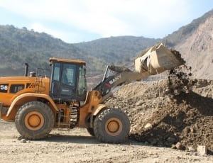 yellow Sany 956 front loader loading soil during daytime thumbnail