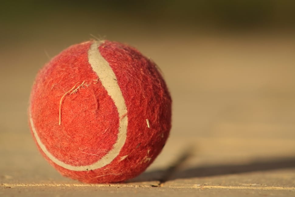 red and white tennis ball preview