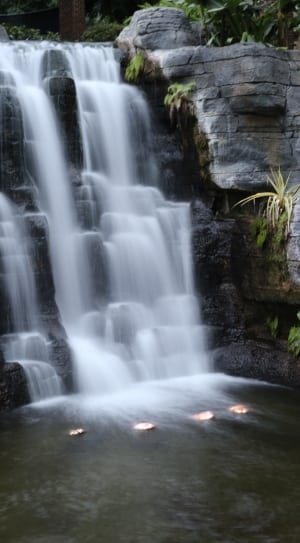 waterfalls with green plants and stone formation thumbnail
