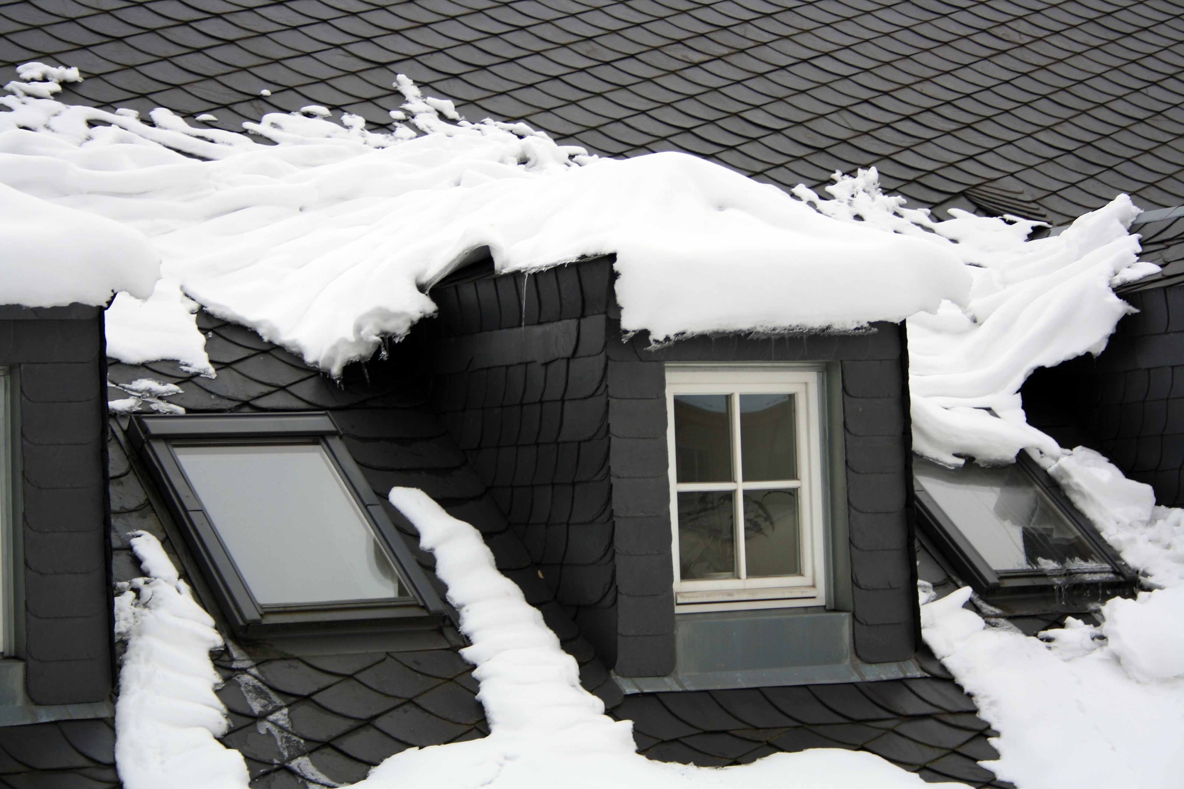 snow covered roof during daytime
