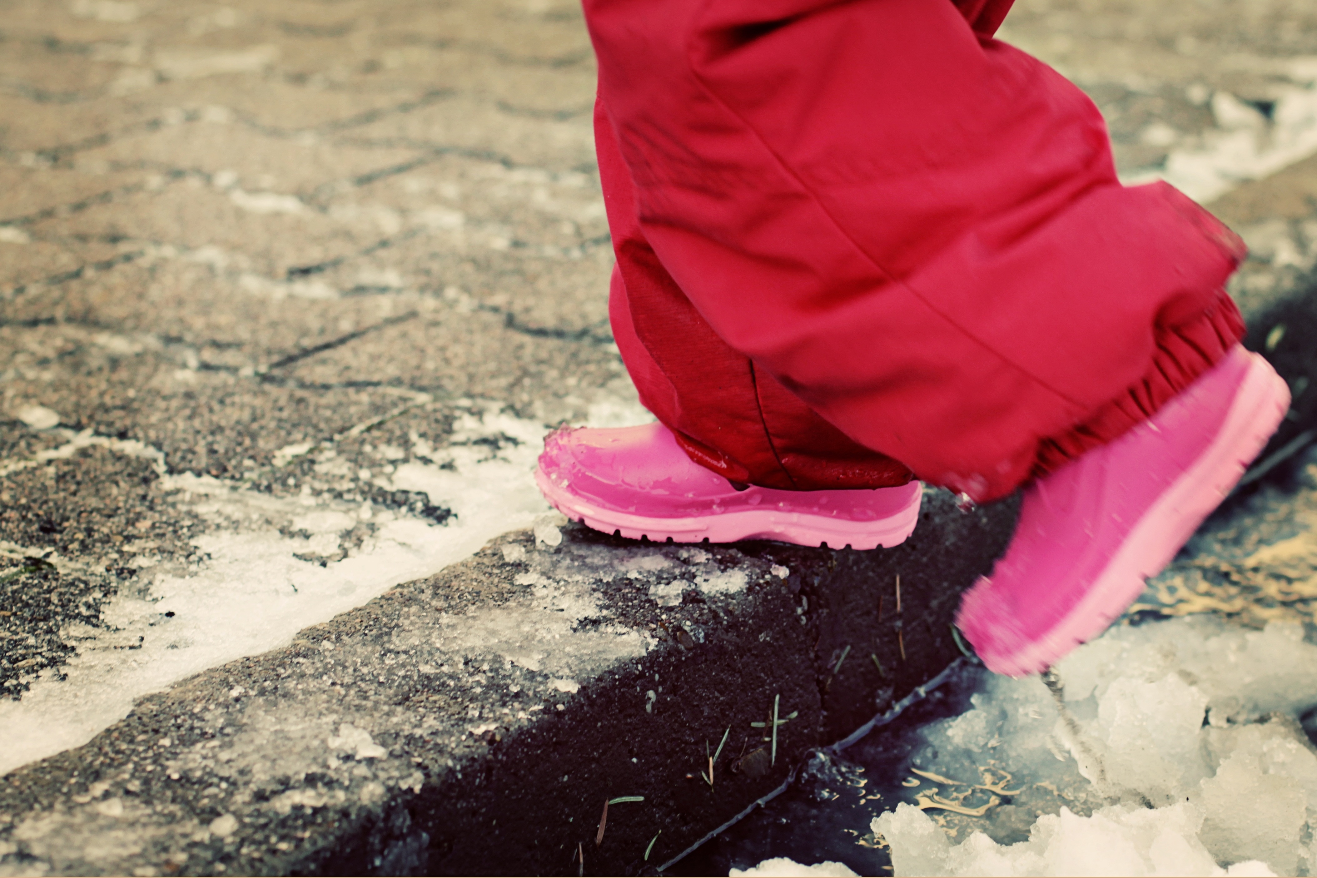 toddler's pink boots and red pants