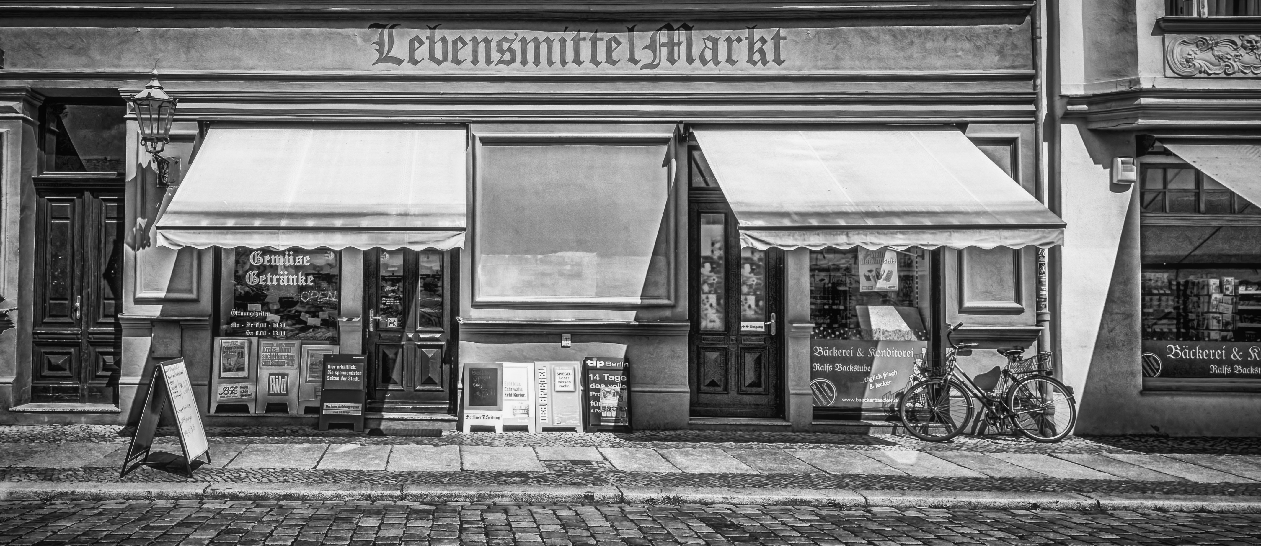 grayscale photo of lebensmitte market