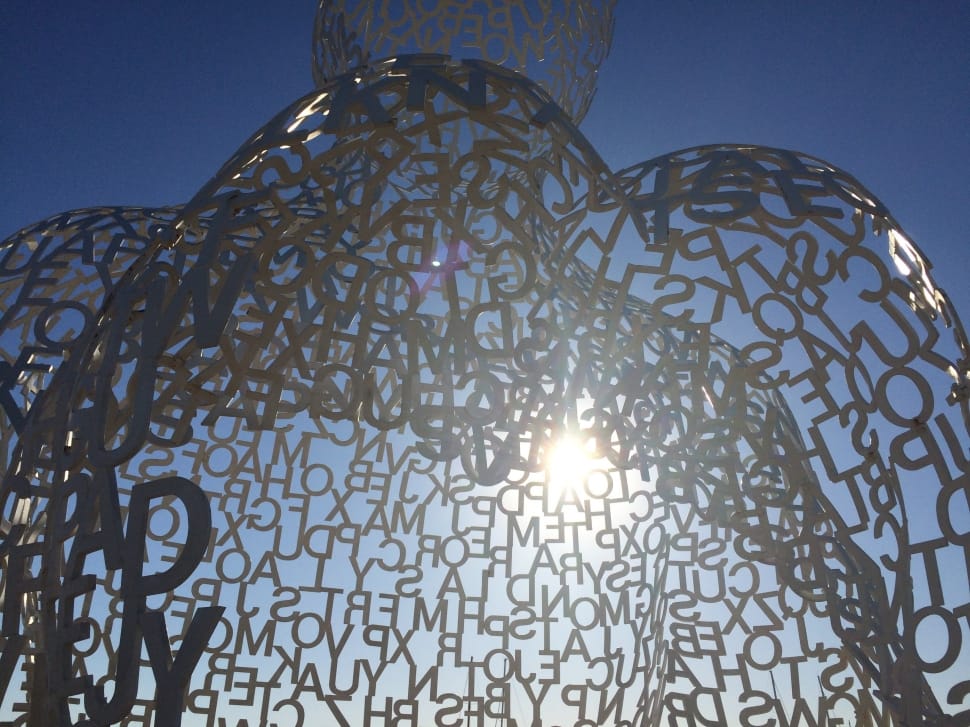 stainless steel Alphabet letters under the sun during daytime preview