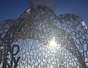stainless steel Alphabet letters under the sun during daytime thumbnail