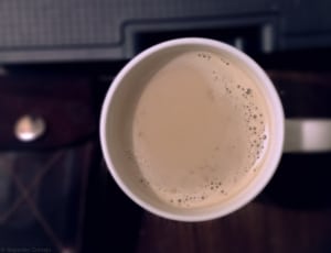 white disposable cup with brown coffee thumbnail