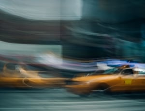 orange taxi cab on the road thumbnail