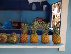 four Pineapple fruits and two coconuts thumbnail