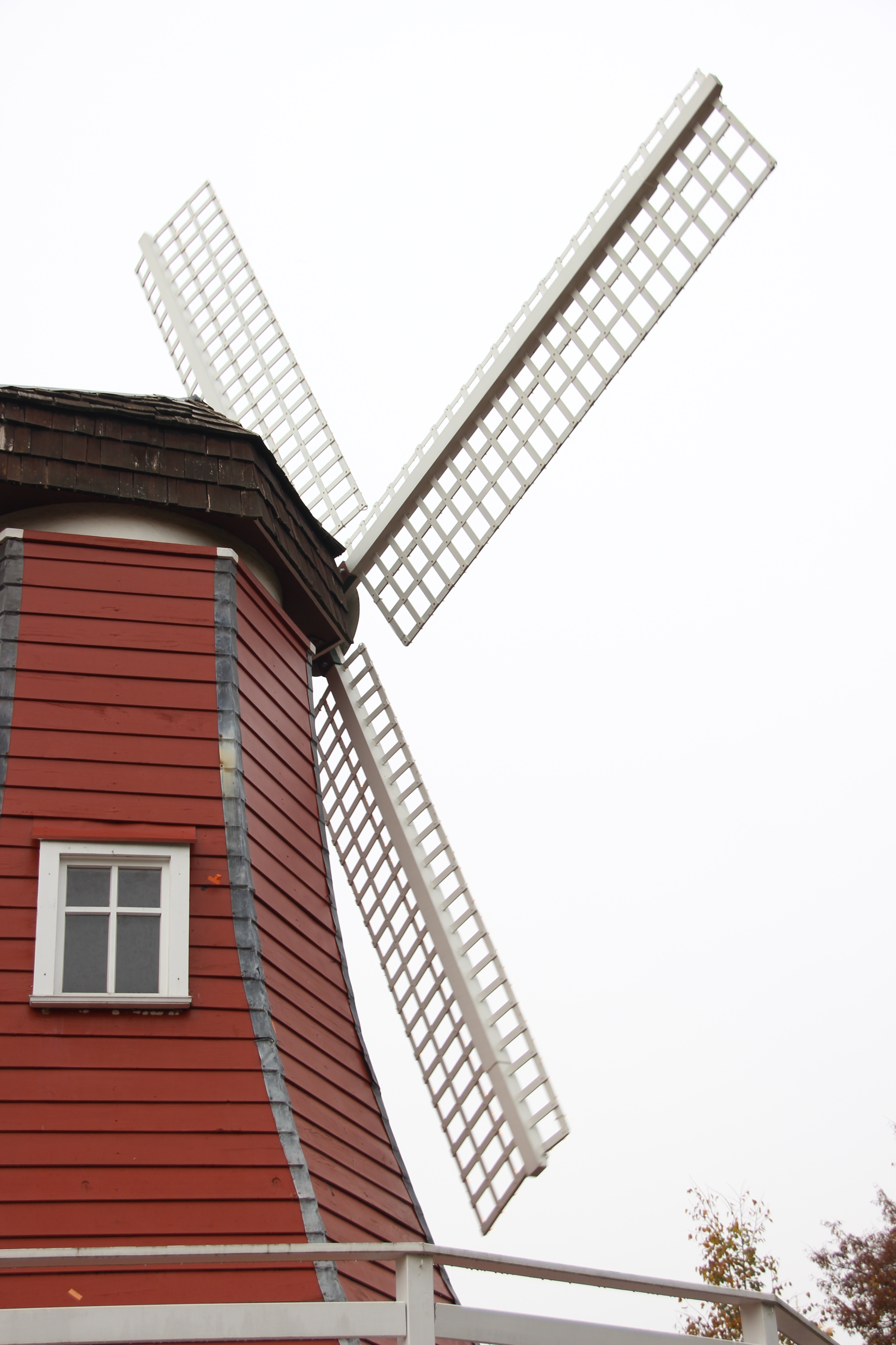 white and brown wooden windmill