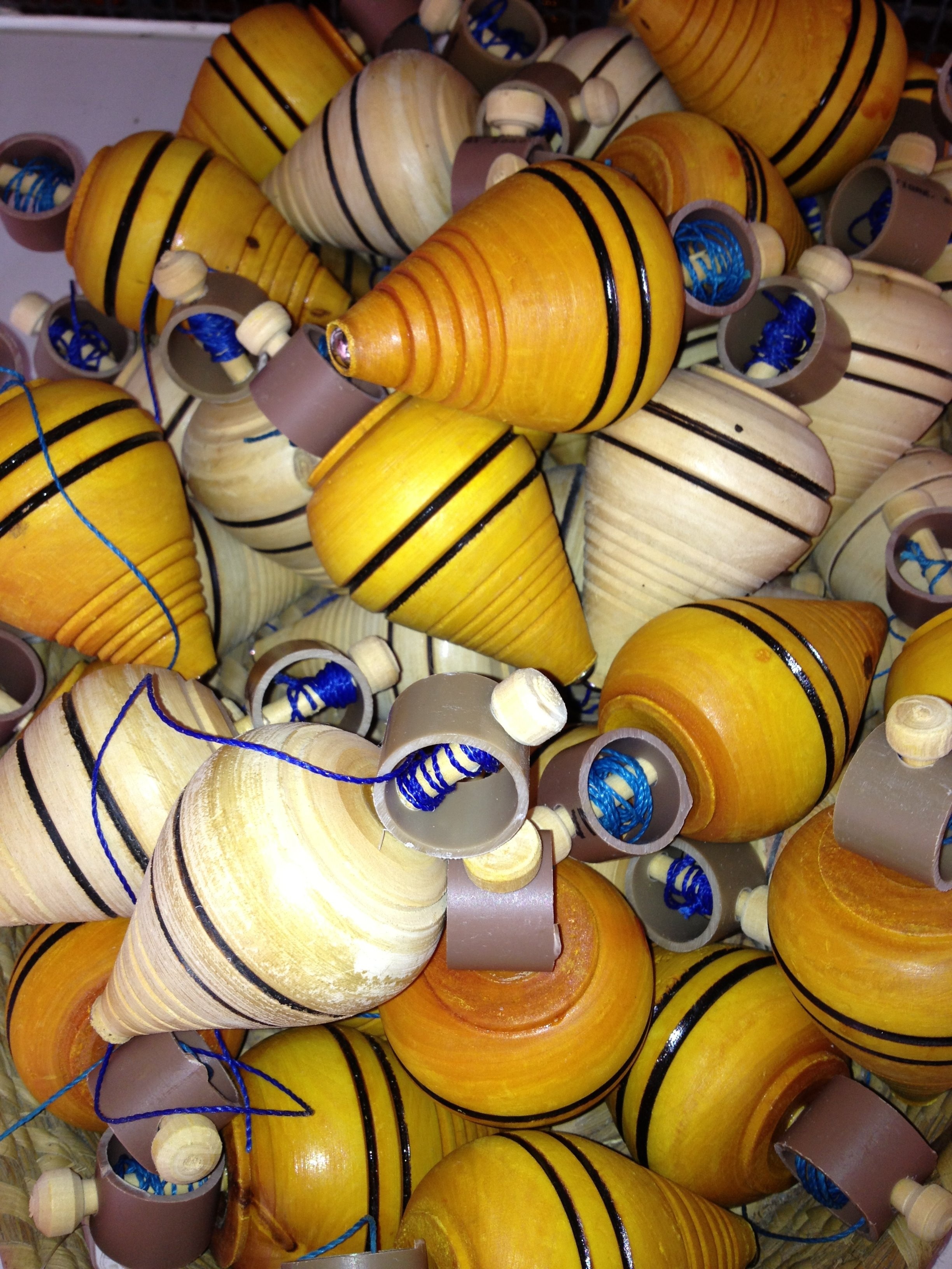 brown and white spinning tops