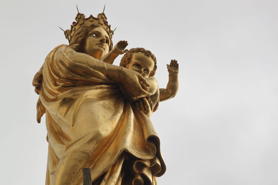 brass woman carrying baby statue preview