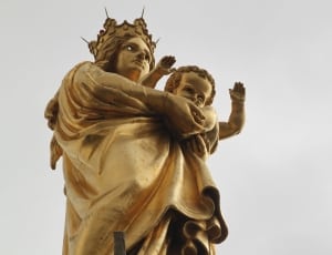 brass woman carrying baby statue thumbnail