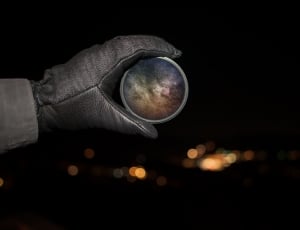 grey glove holdinga grey orb thumbnail