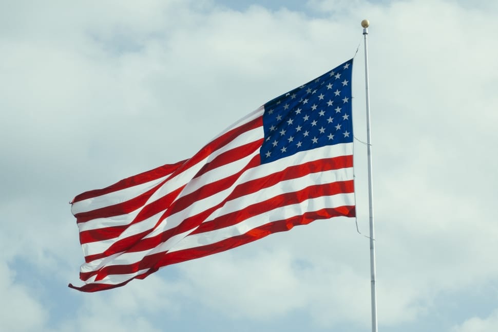 u.s. flag in pole under white cloudy sky preview
