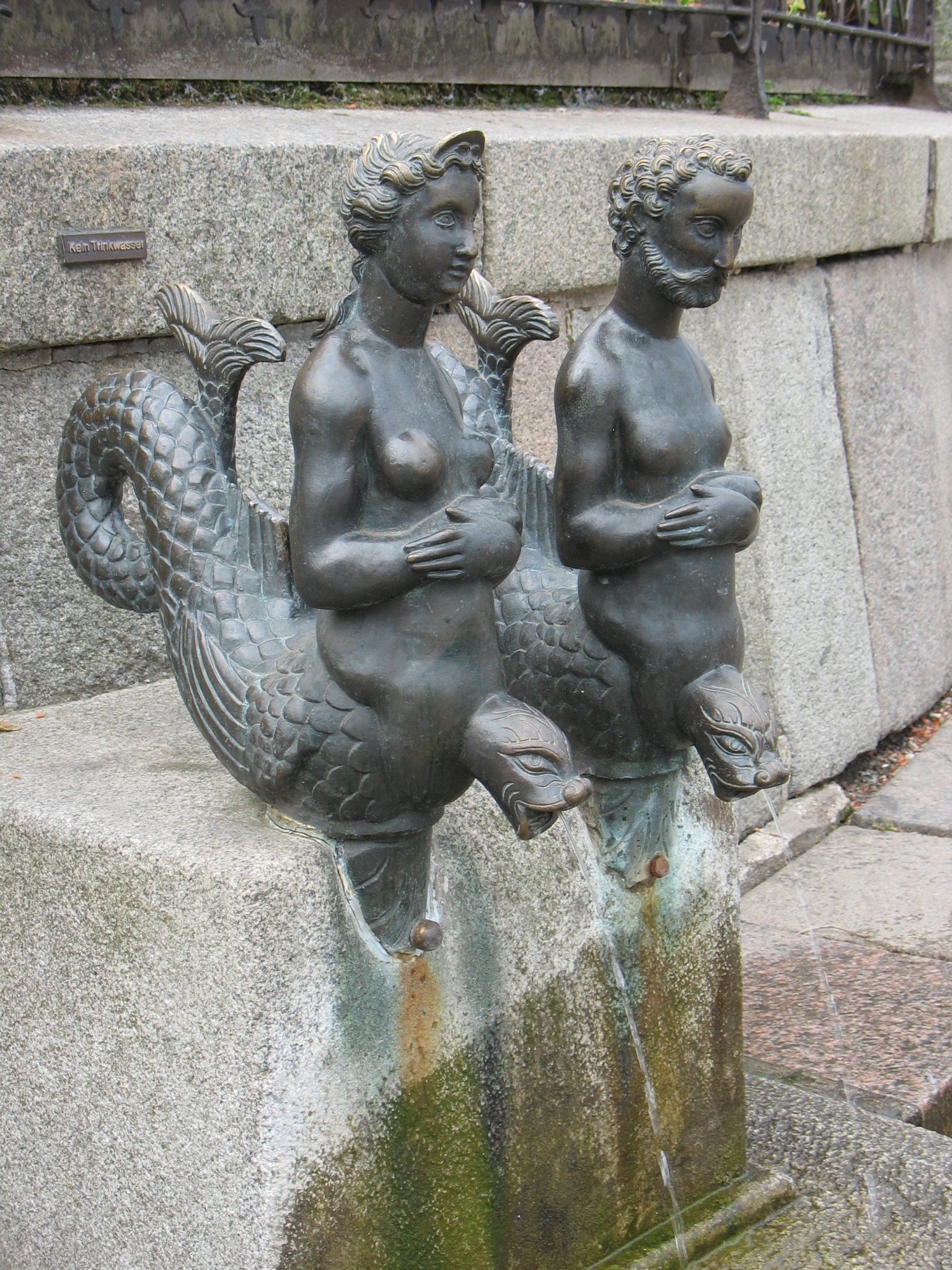 mermaid and merman statues
